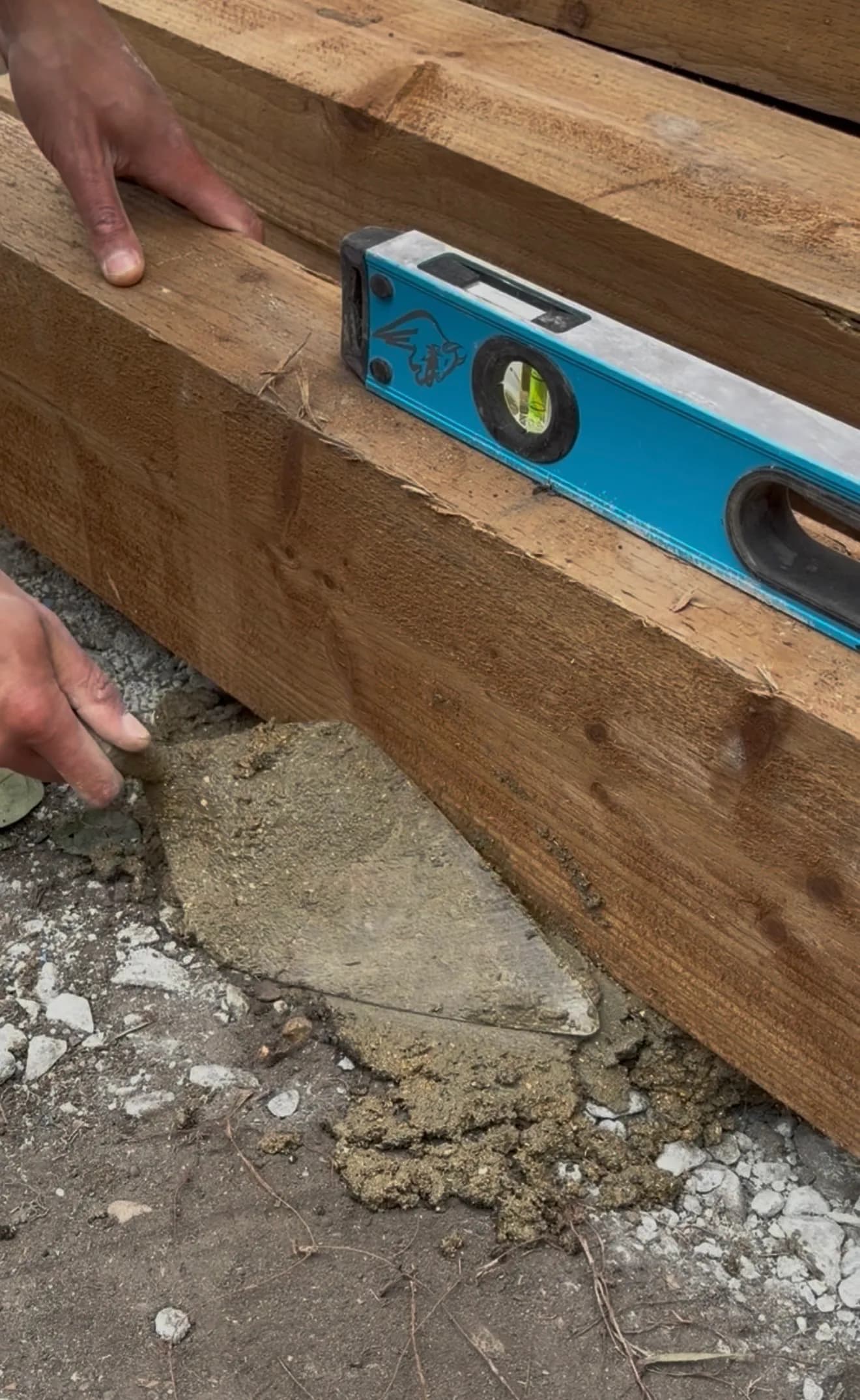 ECH WORKS — Wooden framework assembly with a level ensuring precision.