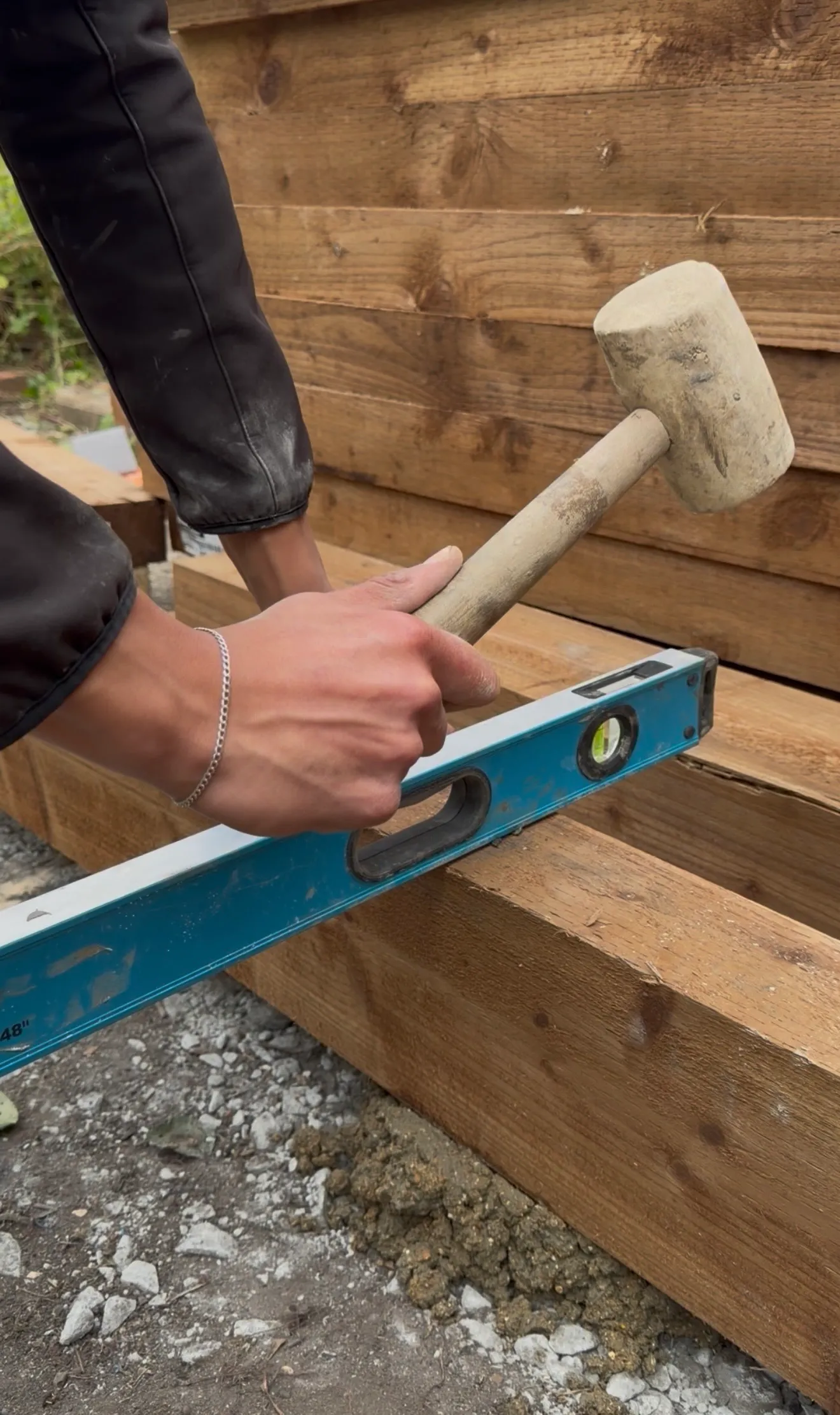 ECH WORKS — Mallet and level used in the construction of raised garden beds.