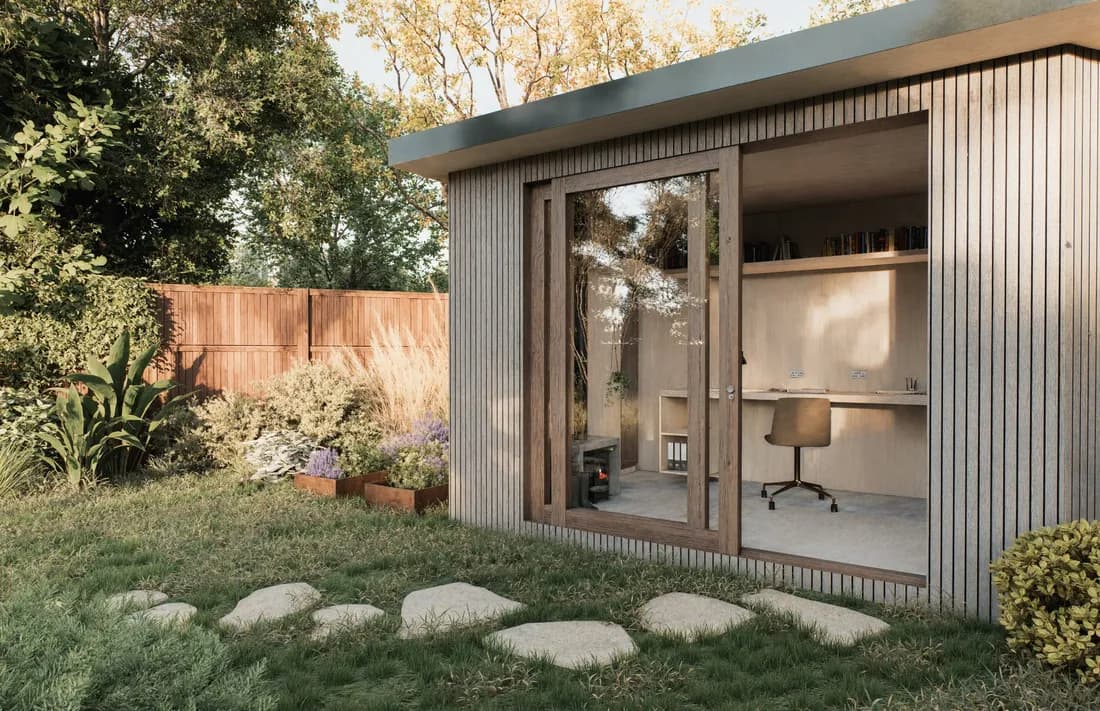 ECH WORKS — Exterior view of a modern garden studio with lush planting and a stepping stone path.